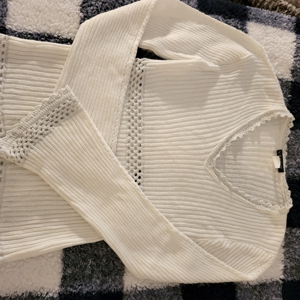 White sweater with silver trim